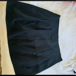 Pleated black mini skirt
